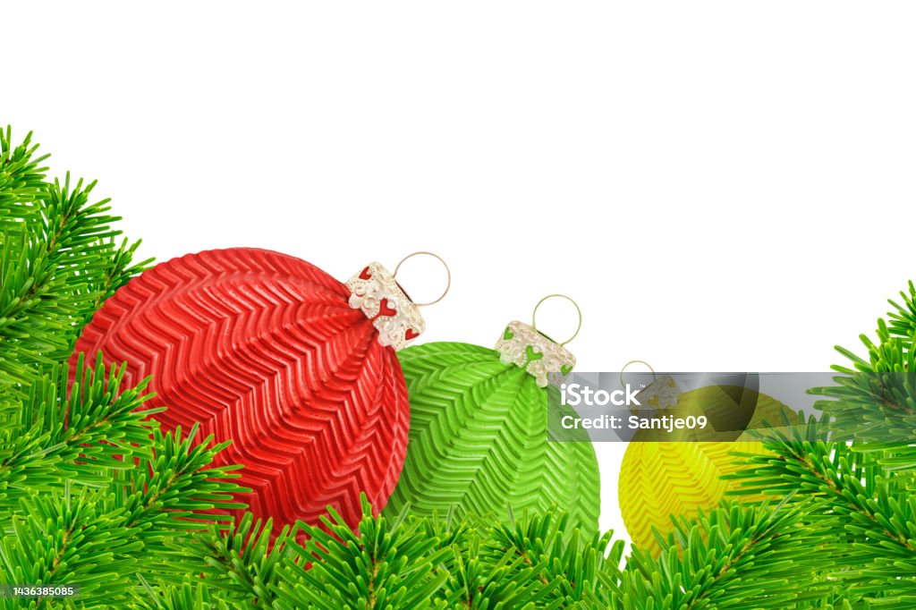 Christmas decoration with fir branches and  3 balls red green yellow isolated on white background Ampelmännchen Stock Photo