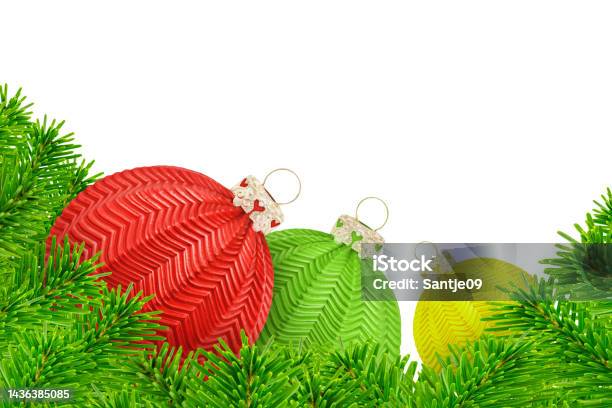 Christmas Decoration With Fir Branches And 3 Balls Red Green Yellow Isolated On White Background Stock Photo - Download Image Now