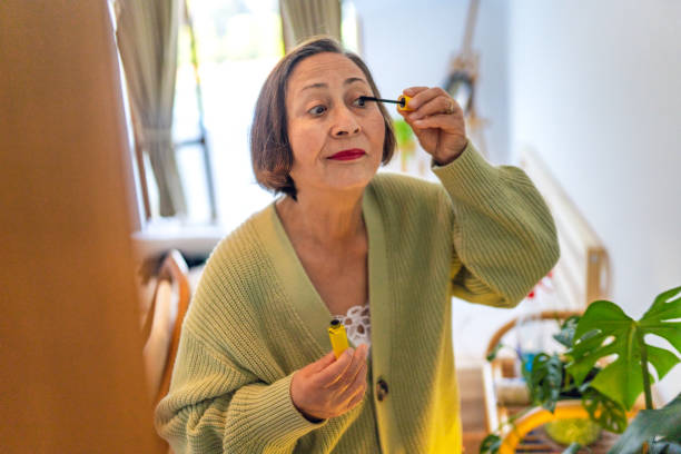 istock Elderly woman doing makeup and taking time for herself 1436385642