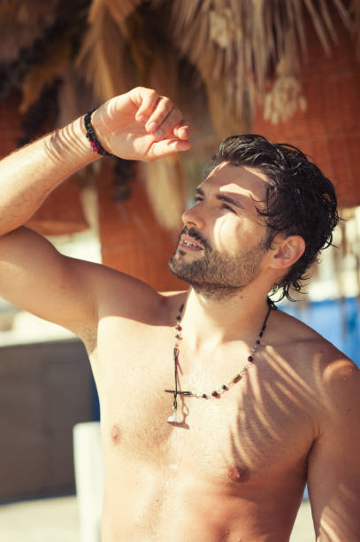 istock Sexy topless young man portrait looking on sun 1436386939