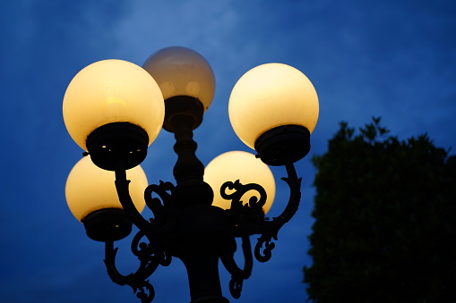 Street lamp against a deep blue sky