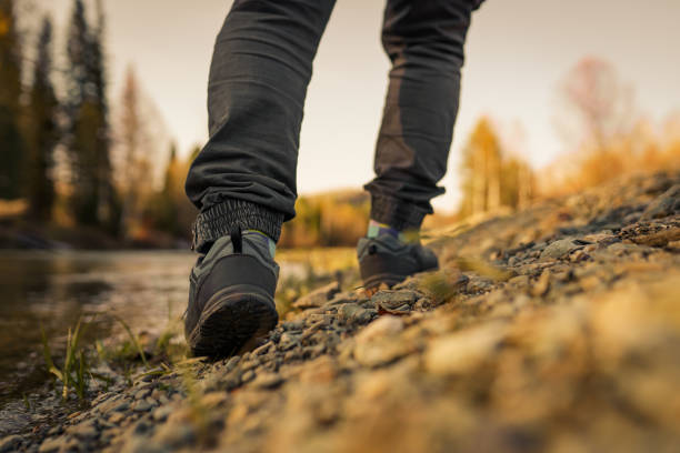 istock men's footsteps on the beach of river 1436387856