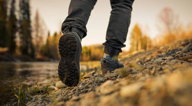 istock men's footsteps on the beach of river 1436387859