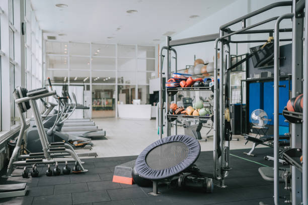 Gym Room with Treadmill and workout equipment stock photo