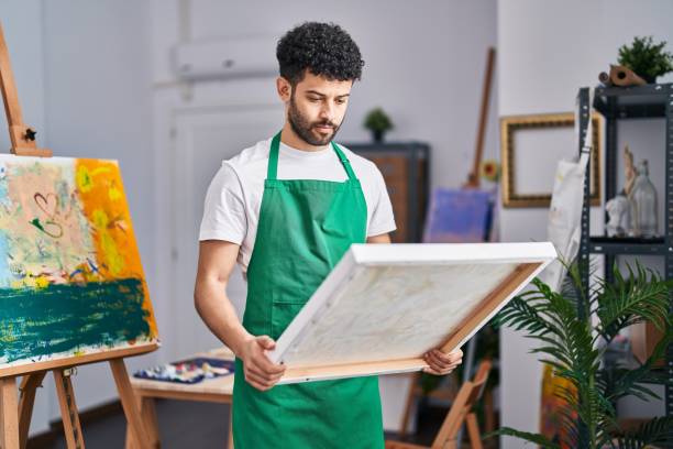 istock man at art studio relaxed with serious expression on face. simple and natural looking at the camera. 1436391431
