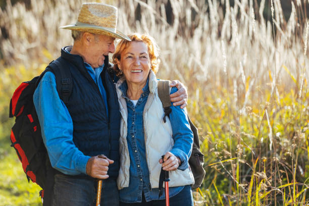istock Senior happy couple embracing each other and walking 1436392407
