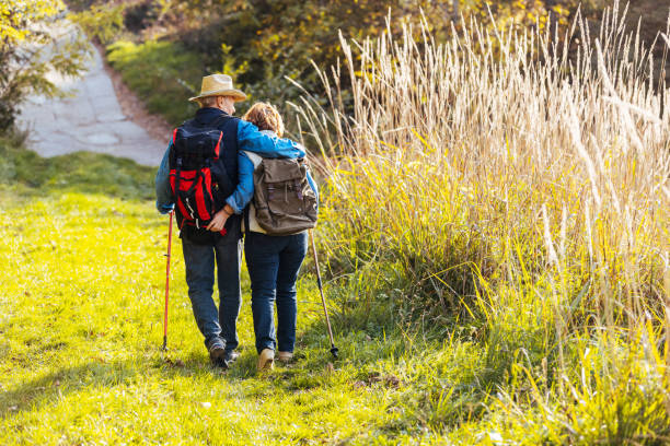 istock Couple going to their camping site in forest 1436393320