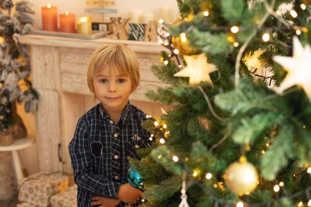 istock Cute child, boy, playing in a decorated room for Christmas 1436393505