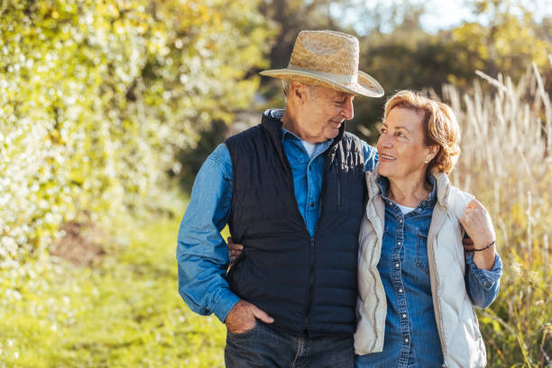 istock Cheerful senior woman having fun with her husband at sunset. 1436393544
