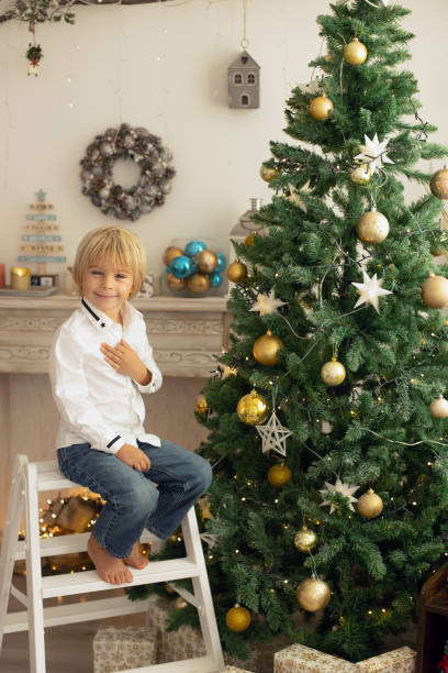 istock Cute child, boy, playing in a decorated room for Christmas 1436394229