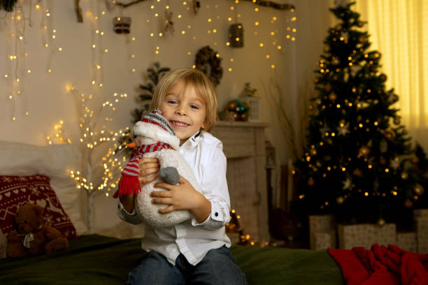 istock Cute child, boy, playing in a decorated room for Christmas 1436395480