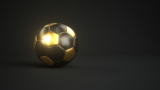 Golden football on a black background. 3d illustration.