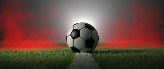 A classic football on the ground with red smoke in the back. 3d illustration.