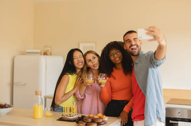 istock Multiracial friends taking selfie during birthday celebration 1436398972