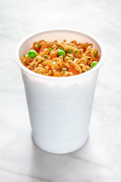 istock Ramen cup, instant soba noodles in a plastic cup with vegetables 1436400190