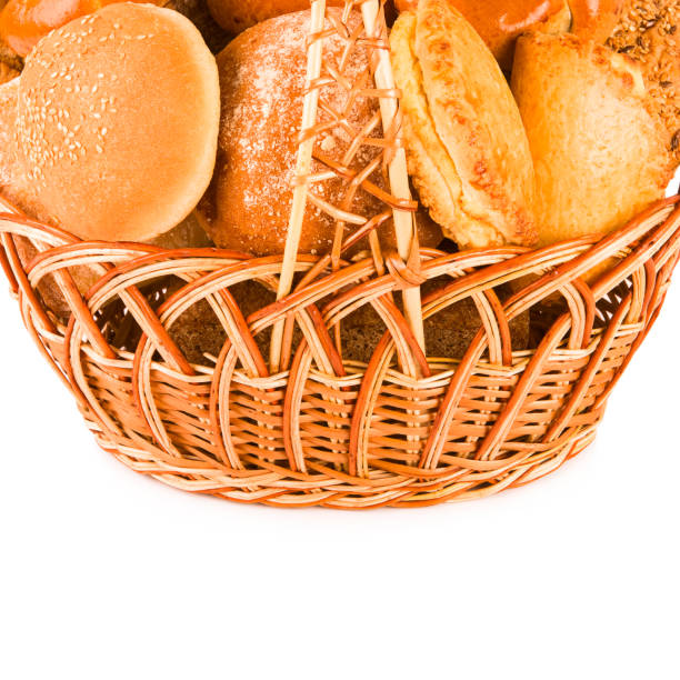 istock Bread and sweet pastry in a wicker basket isolated on white. Free space for text. 1436400869