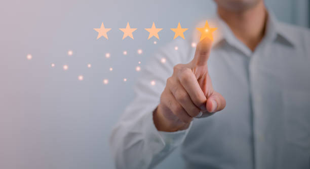 istock Customer service and Satisfaction concept ,Business people are touching the virtual screen on the happy Smiley face icon to give satisfaction in service. rating very impressed. 1436405102