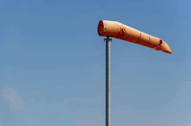 Wind sock swollen and sways in the wind on a sunny day.