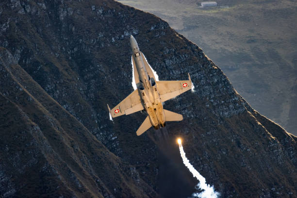 istock F/A18 jet fighter flying in the mountain 1436413255