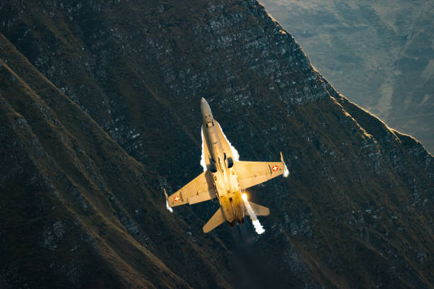 istock F/A18 jet fighter flying in the mountain 1436413267