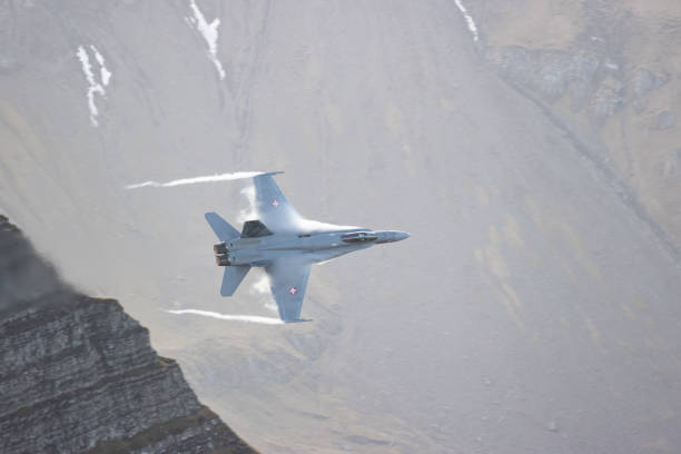 istock F/A18 jet fighter flying in the mountain 1436413293