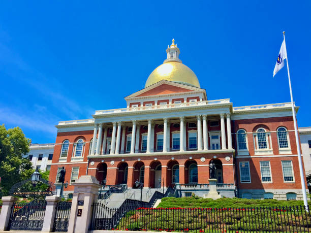 Boston, Massachusetts, USA - June 27, 2019: Sunlight reflects off the gold dome of the Massachusetts State House, the state capitol and seat of government for the Commonwealth of Massachusetts.