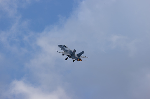  FA-18 airplane against a blue sky.