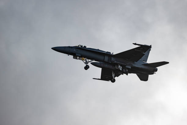 istock F/A18 jet fighter flying in the mountain 1436413364