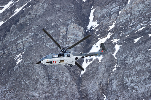 Eurocopter super puma flying in Alps