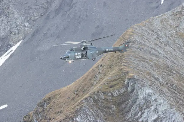 Eurocopter super puma flying in Alps