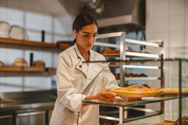 istock Young Hispanic Baker Arranging The Pastry 1436415315