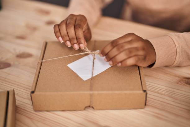 istock African american woman ecommerce business worker preparing, package at office 1436416634