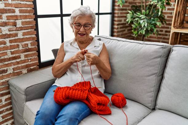 istock Senior grey-haired woman smiling confident sewing using lane and needle at home 1436417631