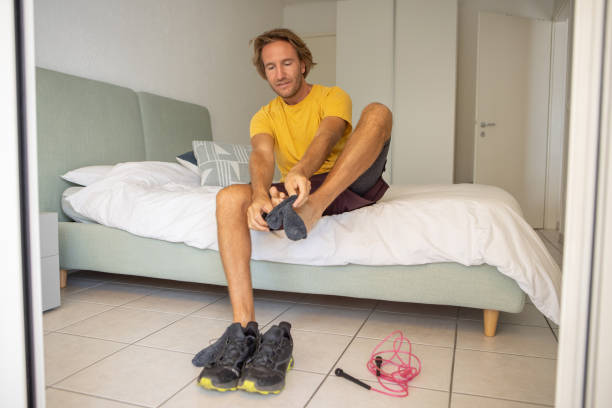 istock Man in his bedroom getting ready fo a workout 1436418930