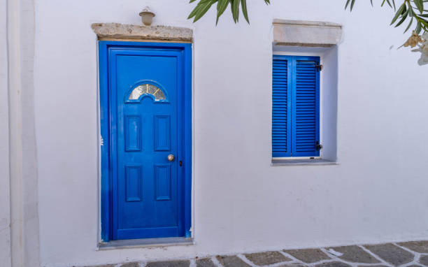 istock Blue door in classic Cyclades style in Greece 1436419153