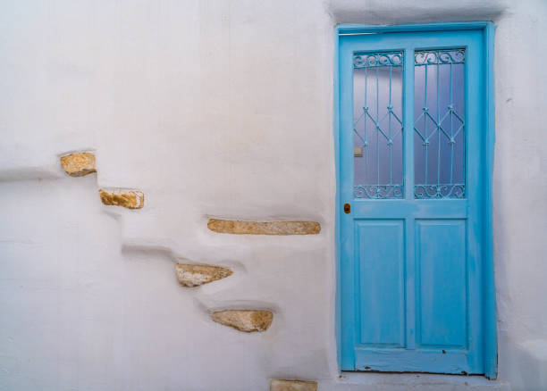 Blue door and white wall in a Greek village stock photo