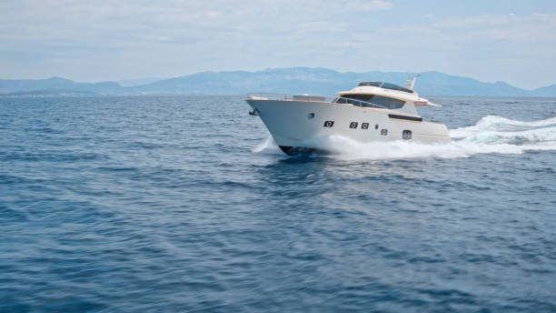 istock Modern yacht cruising in sea 1436420001