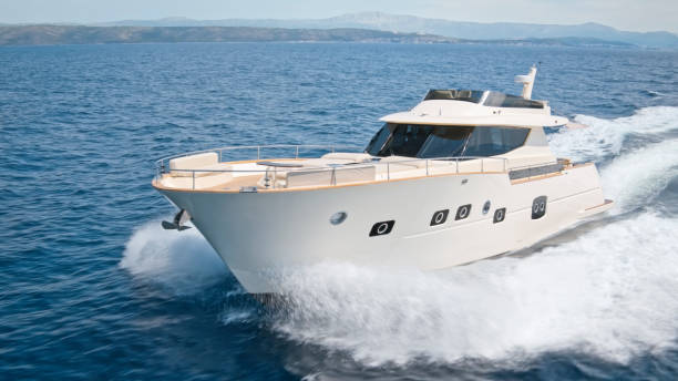 istock Modern yacht cruising in sea 1436420002