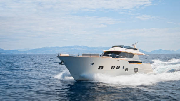 istock Modern yacht cruising in sea 1436420003