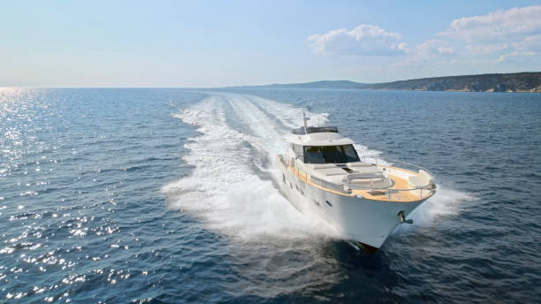 istock Modern yacht cruising in sea 1436420009