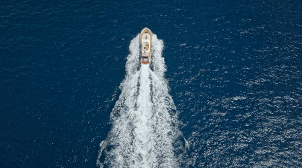 istock Modern yacht cruising in sea 1436420015