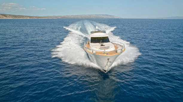 istock Modern yacht cruising in sea 1436420030
