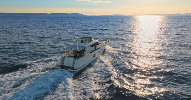 istock Modern yacht cruising in sea 1436420036
