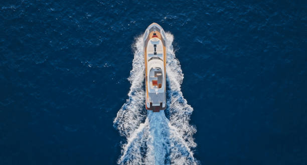 istock Modern yacht cruising in sea 1436420051