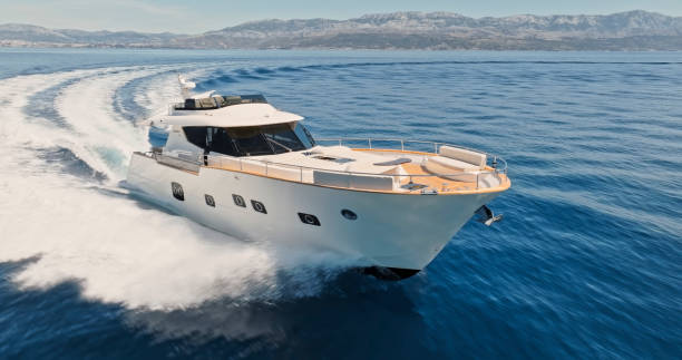 istock Modern yacht cruising in sea 1436420060