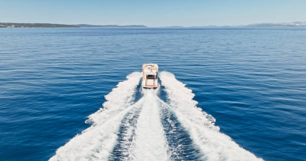 istock Modern yacht cruising in sea 1436420062