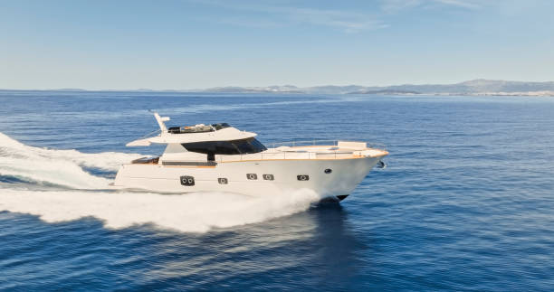istock Modern yacht cruising in sea 1436420071