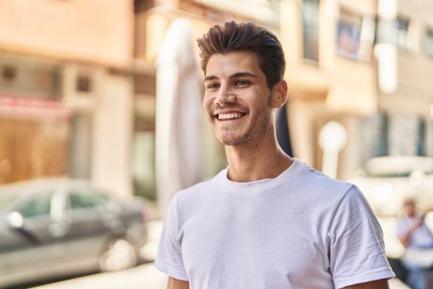 istock Young hispanic man smiling confident looking to the side at park 1436421621