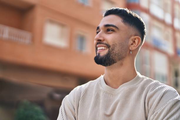 istock Young arab man smiling confident standing at street 1436426497