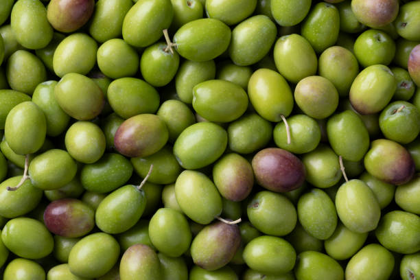 istock Fresh raw green olives close up full frame 1436427061